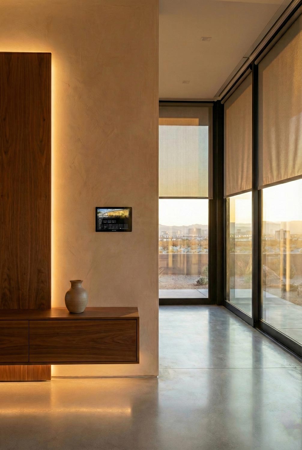 Interior hallway with wood paneling, soft lighting, and wall mounted control panel